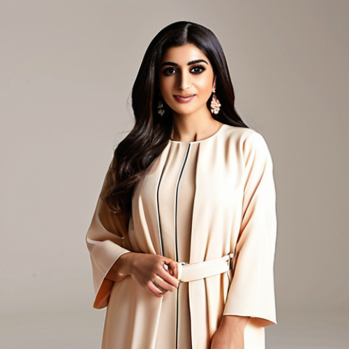 **

A stylish Arab woman confidently posing in a well-lit studio, showcasing a chic and modest outfit. The background is clean and modern, possibly with a subtle Arabic-inspired design element. Focus on conveying confidence, elegance, and relatability to the target audience. The overall aesthetic should be bright and inviting, reflecting a positive and empowering message about fashion.

**